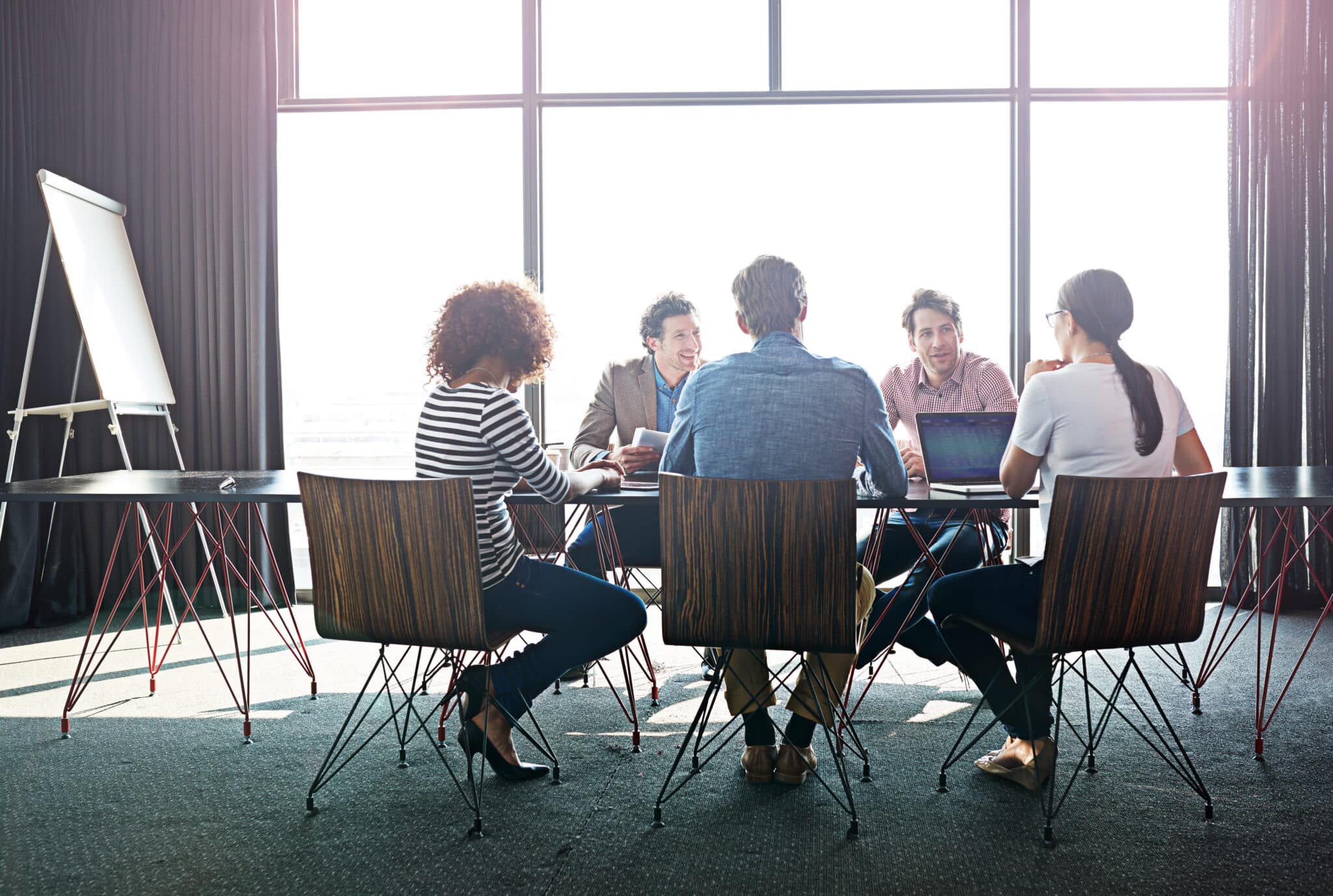 Compliance team meets to discuss alignment of cybersecurity strategies with privacy regulations.