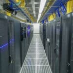 Modern data center with rows of server racks, symbolize the importance of backing up critical data.