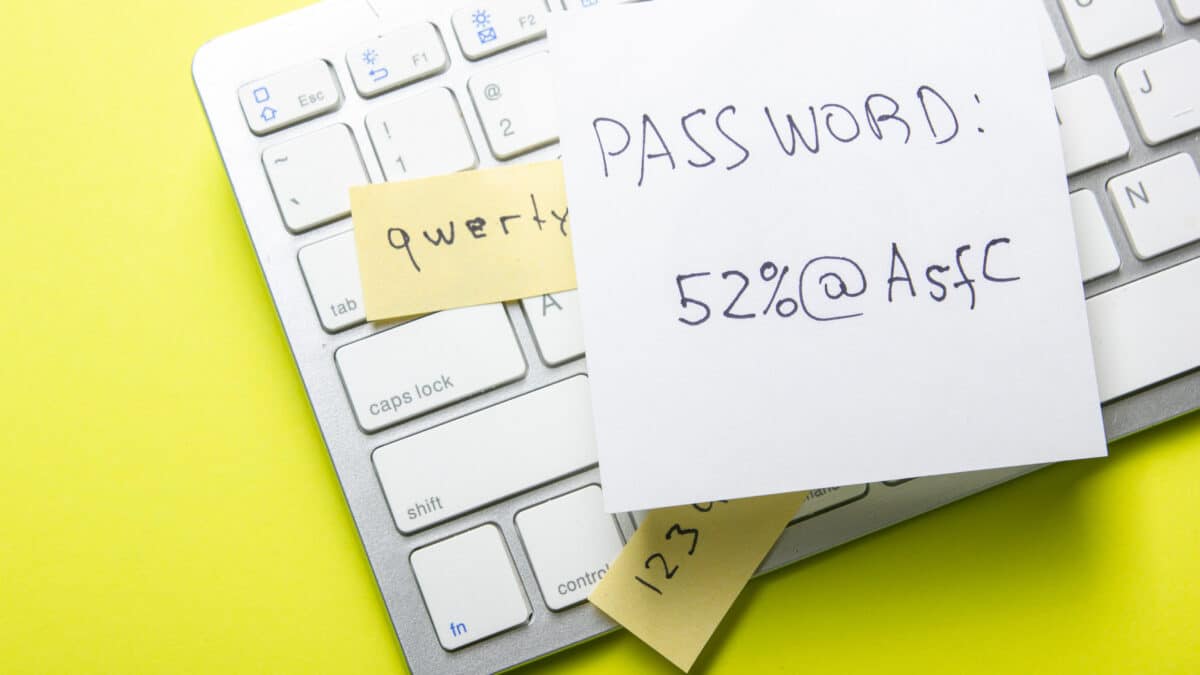 Strong vs. weak password on paper, highlighting Athreon's cybersecurity training for best practices.