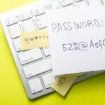 Strong vs. weak password on paper, highlighting Athreon's cybersecurity training for best practices.