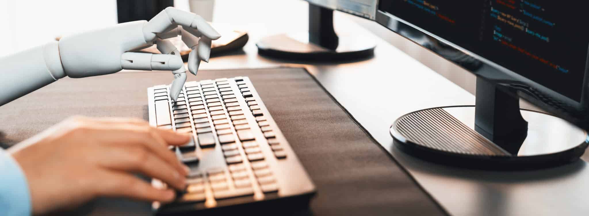 Human and robot hands type on a keyboard; symbolizes AI scribes enhancing productivity and accuracy.