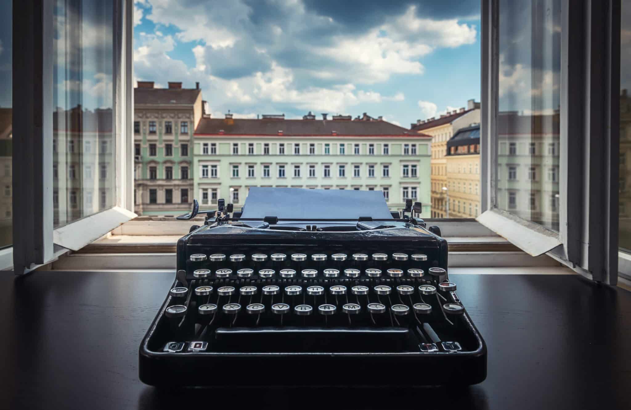 Vintage typewriter on a desk, represents the transition from traditional to modern scribing methods.